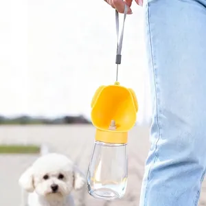 Portable yellow pet water bottle with lanyard for outdoor dog walking and travel