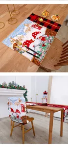 Festive Christmas dining table set with red plaid gnomes chair cover and runner