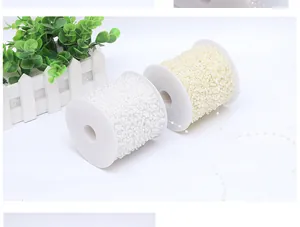 Close-up of 4mm ABS pearl bead rolls in white and cream for bridal hair accessories