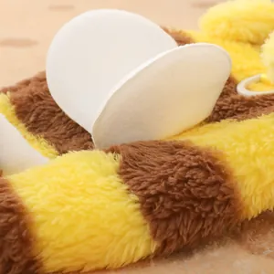 Soft plush bee-themed dog jumpsuit featuring warm yellow stripes and harness ring attachment