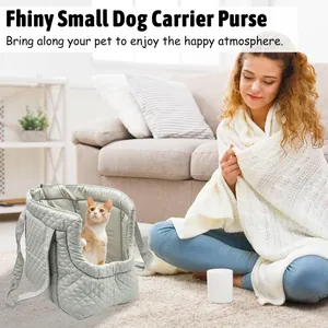 Light grey quilted pet carrier bag shown in a cozy living room scene with a cat inside