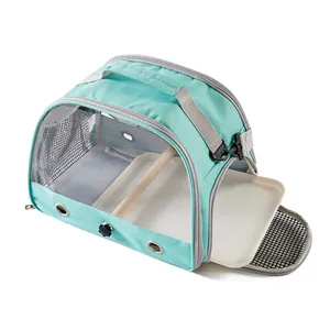 Breathable mint green portable bird carrier bag with wooden perch and removable cleaning tray