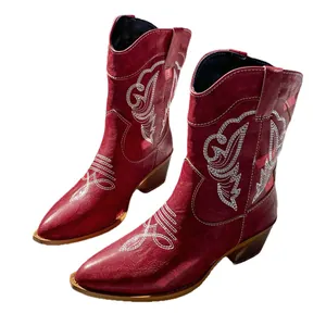 Vintage dark red western cowboy boots featuring white embroidery and chunky mid-heels