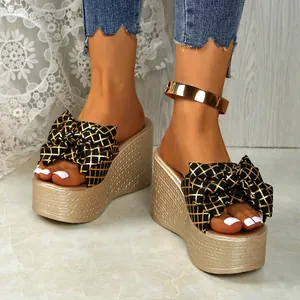 Stylish women's summer wedge platform sandals with elegant black and gold grid bow