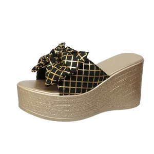 Elegant black and gold lattice bow platform wedge sandals for summer fashion style