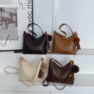 Women Soft PU Leather Shoulder Bag Retro Commuter Hobo Bag Large Capacity Underarm Bag With Pompom Tassel Charm Crossbody Handbag