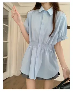 Light blue women's short sleeve shirt featuring an elasticated waist for a slim fit summer style