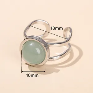 Silver titanium steel open ring with green natural stone and size measurements