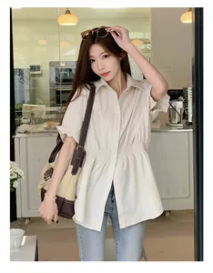 Stylish beige short-sleeved button-up shirt with flattering shirred waist for summer
