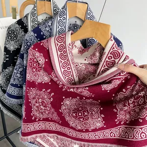 Close-up view of imitation cashmere shawl with elegant paisley pattern and fringe