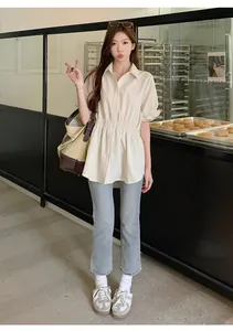 Elegant beige short sleeve peplum shirt with elastic waist for a slimming look