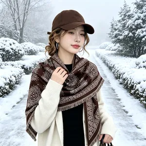 Warm brown winter shawl with elegant paisley pattern and fringe details.
