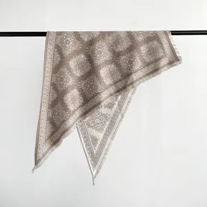 Warm faux cashmere triangle shawl featuring intricate paisley patterns and delicate fringes