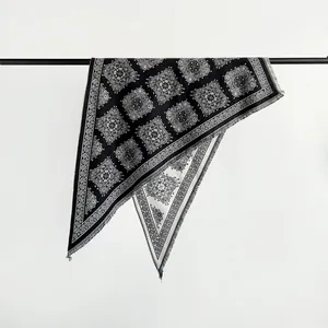 Elegant black and white paisley triangle shawl with fringe details for autumn and winter