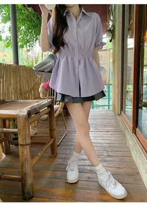 Lavender short-sleeved shirt with elasticated waist shown in an outdoor lifestyle setting
