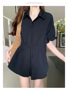 Chic black short-sleeved shirt featuring a slimming elastic cinched waist for a modern look.