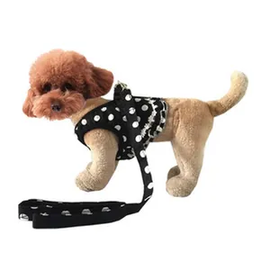 Detail of stylish black and white polka dot dog harness with matching leash set for small dogs