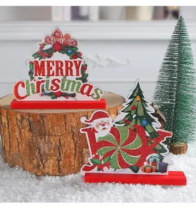 Detailed view of festive wooden Christmas plaques with MERRY Christmas and JOY motifs.