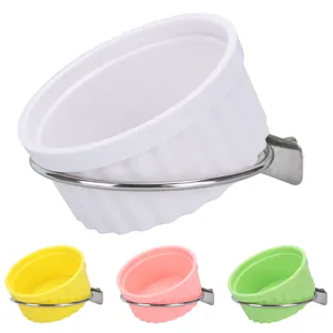 Detailed view showing colorful parrot bird feeding cups with stainless steel brackets