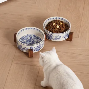 Vintage blue and white porcelain ceramic cat bowl set with elevated acacia wood stands