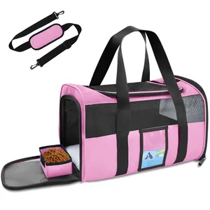 Close-up detail of the pink foldable pet carrier bag with mesh windows and food bowl