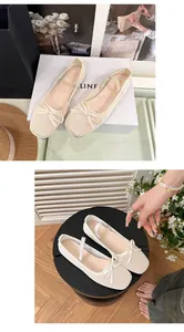 Detailansicht eleganter, atmungsaktiver cremefarbener Mesh-Ballerinas mit Schleifendetail