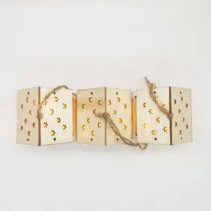 Decorative wooden Christmas mini house string lights featuring glowing star cutouts