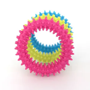 Durable TPR spiky rings for dog teething and molar cleaning training in vibrant colors.