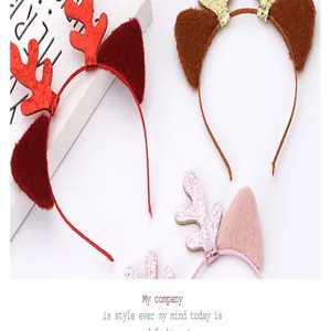 Close-up detail of cute festive reindeer ear headbands in red and brown for Christmas
