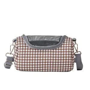 Detailed view of breathable houndstooth small pet carrier bag with mesh top and strap