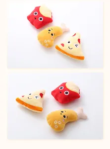 Close-up of cute food-shaped plush cat toys including fries, chicken leg, and pizza.