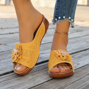 Elegant summer yellow floral open-toe wedge sandals with perforated strap details