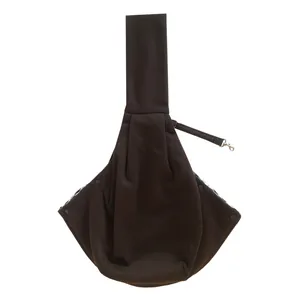 Detail view of dark brown pet sling carrier with wide shoulder strap and internal safety leash