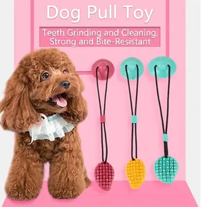 Durable mango-shaped suction cup dog tug toy for teething and deep tooth cleaning