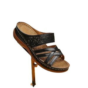 Stylish women's black wedge sandals with cutout patterns and comfortable thick sole