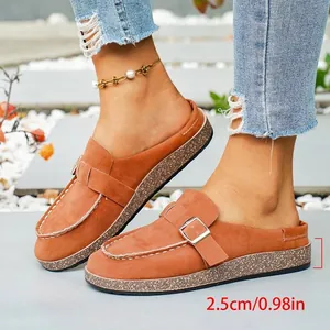 Detail view of brown suede-like mules showing the 2.5cm heel height with metal buckle