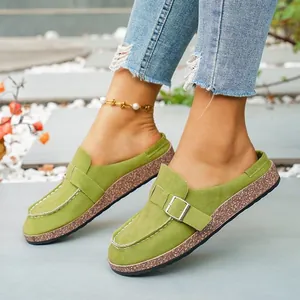 Green faux suede mules with metal buckle and cork platform sole