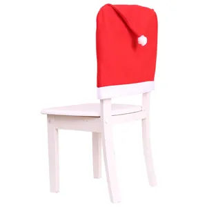 Red Santa hat chair cover for festive Christmas dining room decor, white background