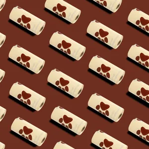 Seamless pattern of chocolate-scented dog poop bag rolls on a deep brown background