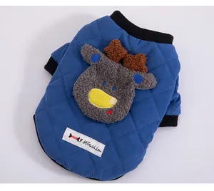 Detail view of quilted blue pet vest featuring a plush cartoon deer applique
