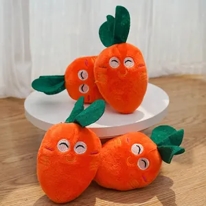 Close-up of four orange plush carrot toys for pets with cute smiling embroidered faces.