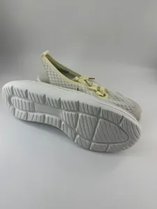 Detailed view of women's breathable mesh walking shoe with anti-slip sole texture
