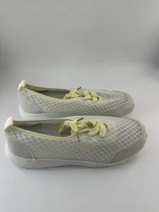 Side view of breathable mesh slip-on walking shoes for women in beige and grey color