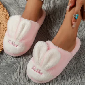 Cozy pink and white rabbit head plush slippers for indoor winter warmth and comfort