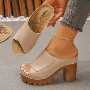 Beige platform peep-toe sandals with chunky high heels and wooden texture soles