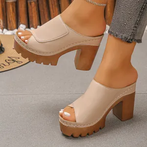 Close-up of beige peep-toe platform sandals with chunky wood-texture heels
