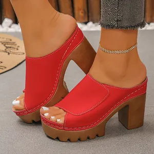 Detailed side view of red platform peep-toe sandals with chunky wood-grain heels