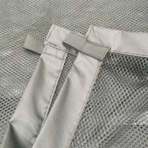 Close-up detail of durable grey mesh fabric for portable foldable pet safety isolation gate
