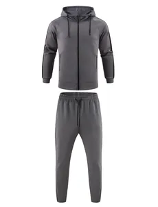 Premium grey men's athletic tracksuit set featuring a zip-up hoodie and matching side-stripe joggers