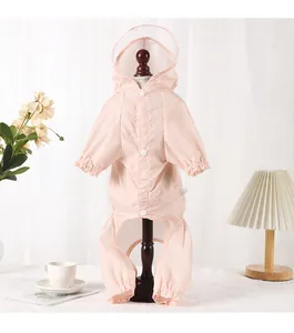 Pink polka dot pet raincoat with a hood and four-legged waterproof protection for small dogs.